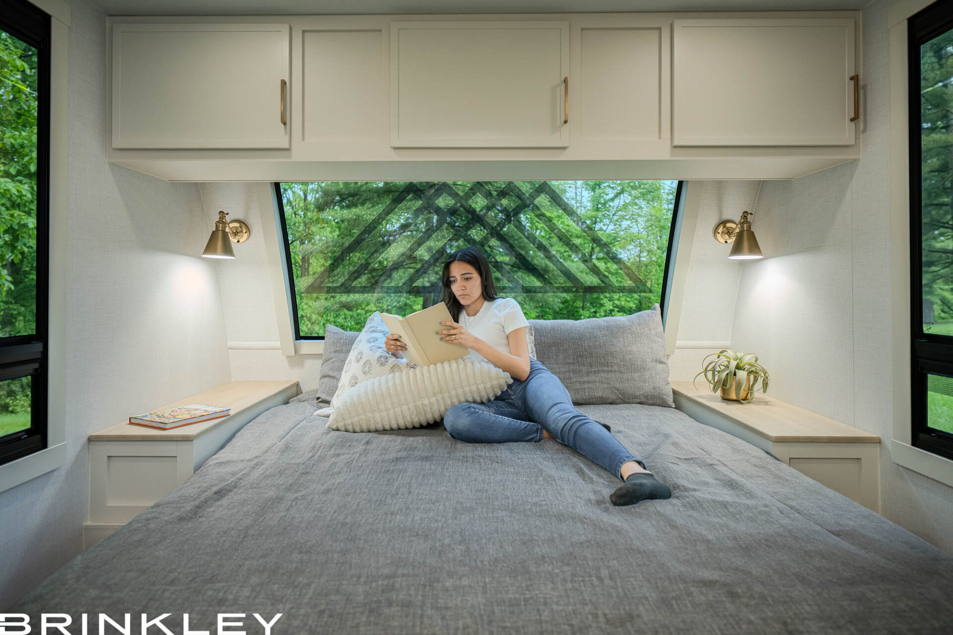 | Model I Travel Trailer Line 20 nterior view of the Brinkley RV Model I 294 master suite featuring the automotive-grade Picture Perfect front window and residential king mattress. Known for building the highest quality travel trailers, Brinkley engineers this bedroom with panoramic views and integrated bedside storage to solve common space and lighting issues found in traditional coaches.
